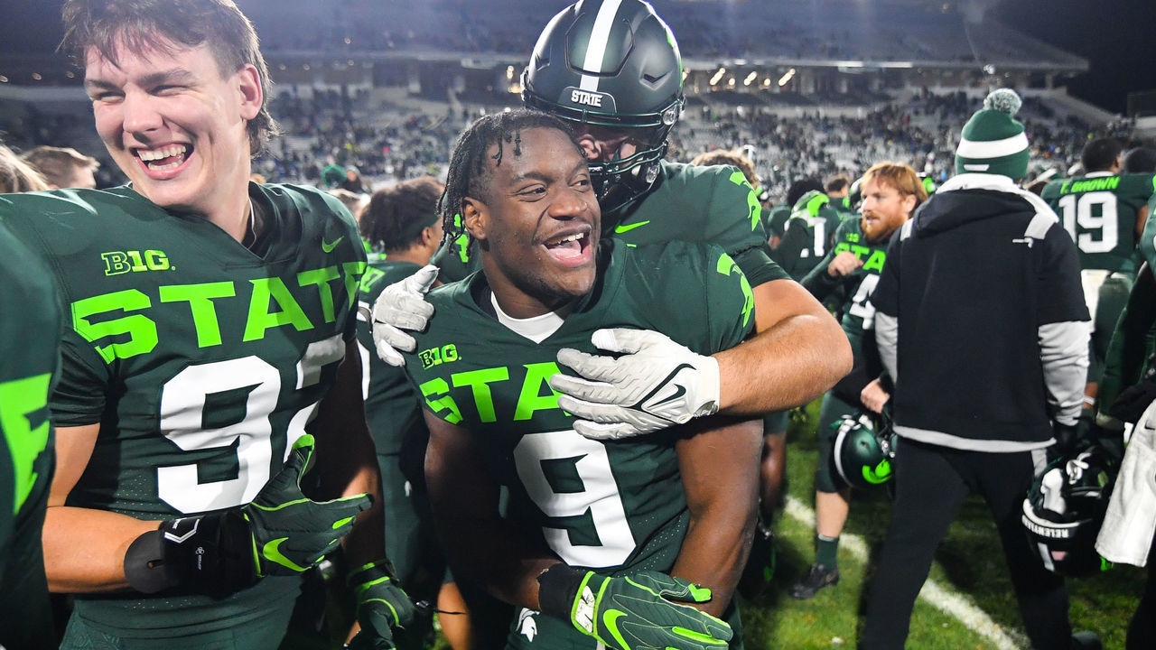 EAST LANSING, MI - NOVEMBER 13: Michigan State Spartans running back Kenneth Walker (9) celebrates with teammates following a college football game between the Michigan State Spartans and the Maryland Terrapins on November 13, 2021 at Spartan Stadium in East Lansing, MI.