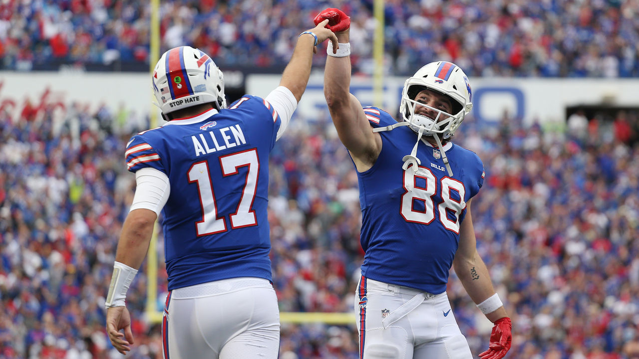 ORCHARD PARK, NEW YORK - SEPTEMBER 26: Quarterback Josh Allen #17 and Dawson Knox #88 of the Buffalo Bills celebrate after a rushing touchdown by Allen during the fourth quarter of the game against the Washington Football Team at Highmark Stadium on September 26, 2021 in Orchard Park, New York.