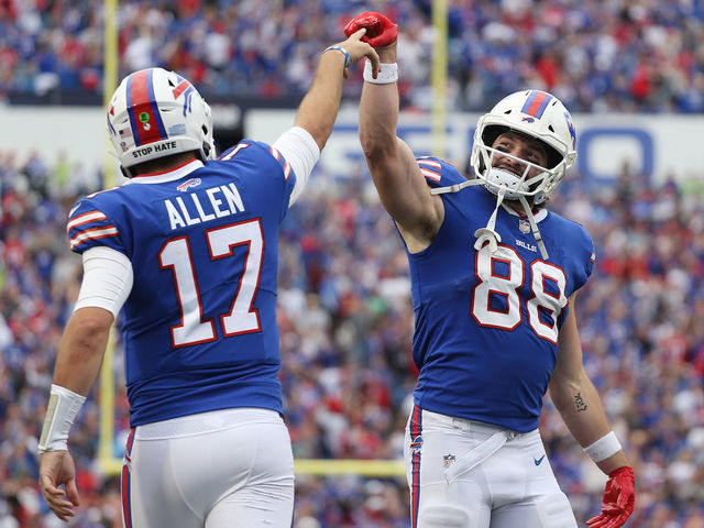 ORCHARD PARK, NEW YORK - SEPTEMBER 26: Quarterback Josh Allen #17 and Dawson Knox #88 of the Buffalo Bills celebrate after a rushing touchdown by Allen during the fourth quarter of the game against the Washington Football Team at Highmark Stadium on September 26, 2021 in Orchard Park, New York.