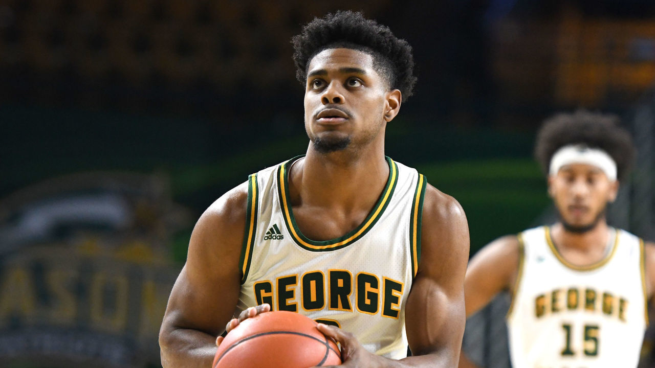 FAIRFAX, VIRGINIA - NOVEMBER 14: Xavier Johnson #2 of the George Mason Patriots takes a foul shot during a college basketball game against the Morgan State Bears at the Eagle Bank Arena on November 14, 2021 in Fairfax, Virginia.