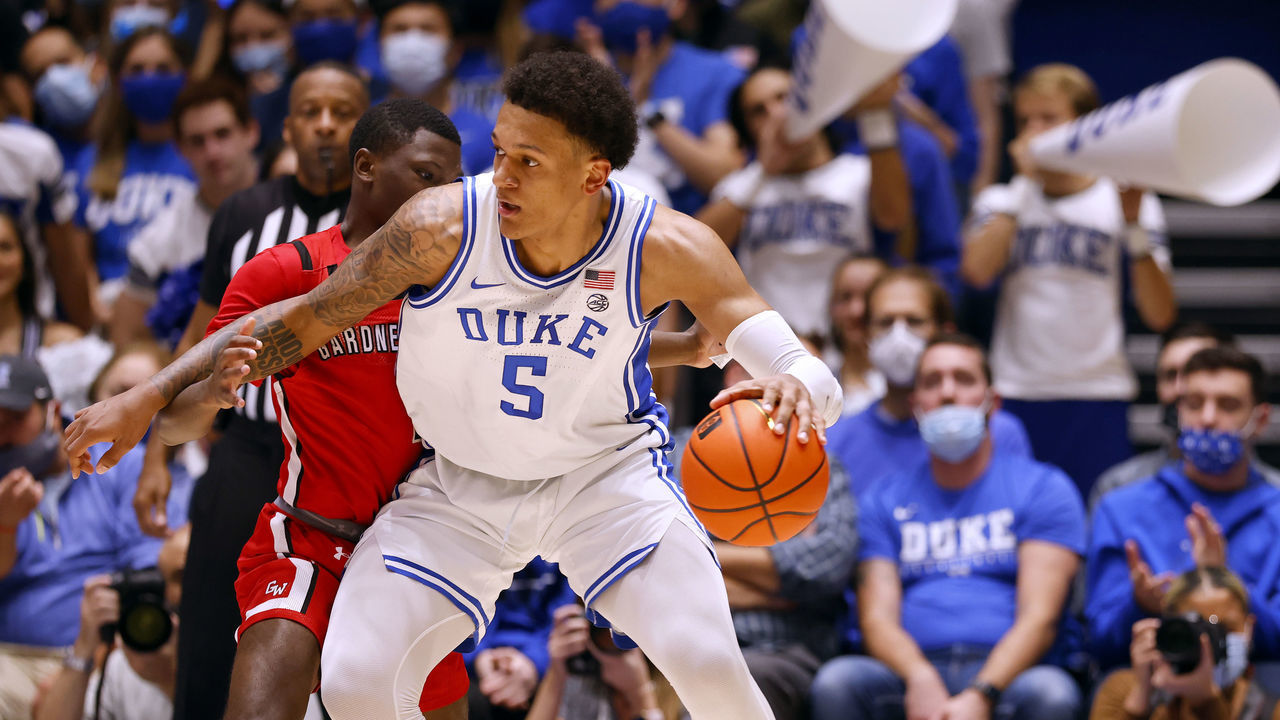 DURHAM, NORTH CAROLINA - NOVEMBER 16: Julien Soumaoro #1 of the Gardner Webb Runnin' Bulldogs defends Paolo Banchero #5 of the Duke Blue Devils during the first half of their game at Cameron Indoor Stadium on November 16, 2021 in Durham, North Carolina.
