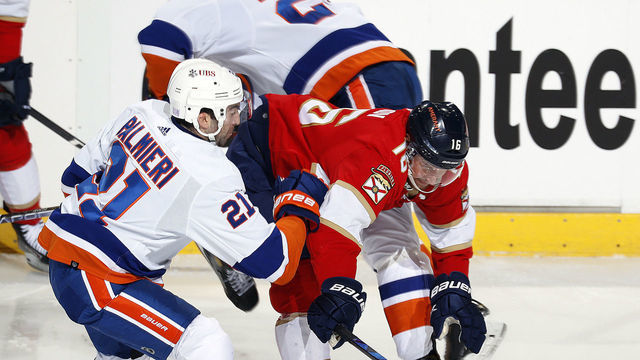 SUNRISE, FL - NOVEMBER 16: Kyle Palmieri #21 of the New York Islanders tangles with Aleksander Barkov #16 of the Florida Panthers at the FLA Live Arena on November 16, 2021 in Sunrise, Florida.