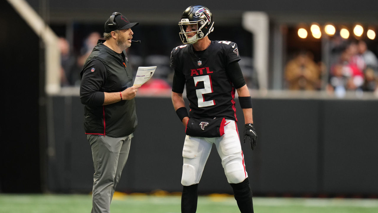 ATLANTA, GEORGIA - OCTOBER 31: Head coach Arthur Smith of the Atlanta Falcons and Matt Ryan #2 meet in the fourth quarter against the Carolina Panthers at Mercedes-Benz Stadium on October 31, 2021 in Atlanta, Georgia.