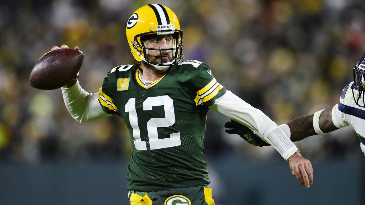 GREEN BAY, WISCONSIN - NOVEMBER 14: Aaron Rodgers #12 of the Green Bay Packers looks to pass the ball in the second half against the Seattle Seahawks at Lambeau Field on November 14, 2021 in Green Bay, Wisconsin.