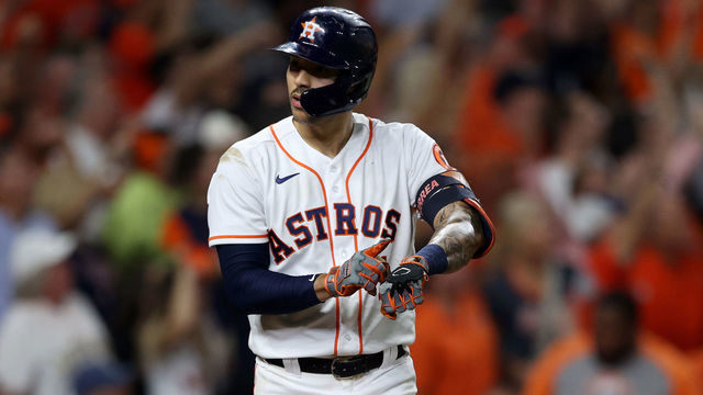 HOUSTON, TEXAS - OCTOBER 15: Carlos Correa #1 of the Houston Astros points to his watch after he hit a home run in the seventh inning against the Boston Red Sox during Game One of the American League Championship Series at Minute Maid Park on October 15, 2021 in Houston, Texas.