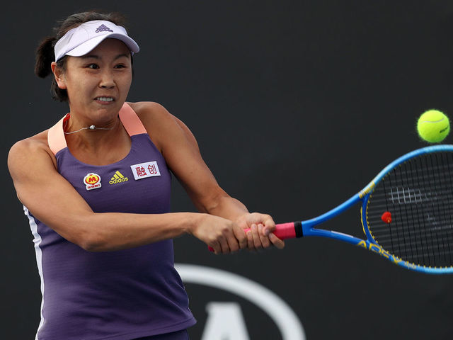 MELBOURNE, AUSTRALIA - JANUARY 23: Shuai Peng of China plays a backhand during her Women's Doubles first round match with partner Shuai Zhang of China against Veronika Kudermetova of Russia and Alison Riske of the United States on day four of the 2020 Australian Open at Melbourne Park on January 23, 2020 in Melbourne, Australia.