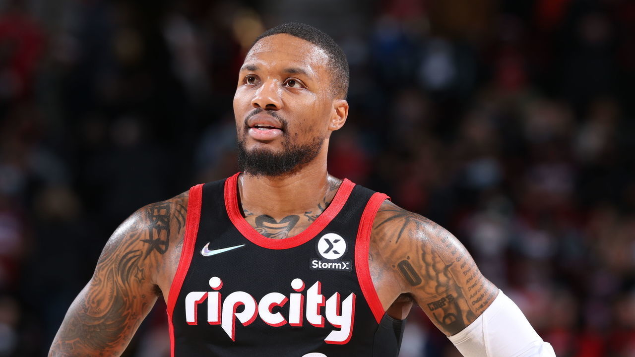 PORTLAND, OR - NOVEMBER 17: Damian Lillard #0 of the Portland Trail Blazers looks on during the game against the Chicago Bulls on November 17, 2021 at the Moda Center Arena in Portland, Oregon. Mandatory Copyright Notice: Copyright 2021 NBAE