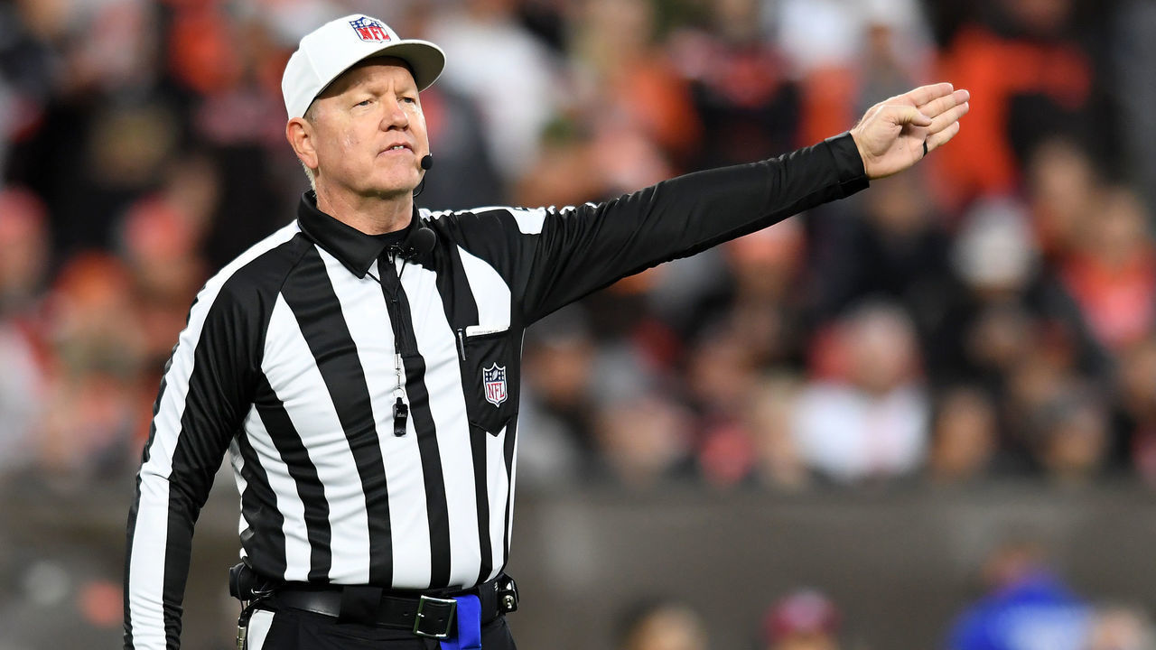 CLEVELAND, OHIO - OCTOBER 17: Referee Carl Cheffers #51 calls a defensive penalty during the fourth quarter of the game between the Cleveland Browns and the Arizona Cardinals at FirstEnergy Stadium on October 17, 2021 in Cleveland, Ohio.