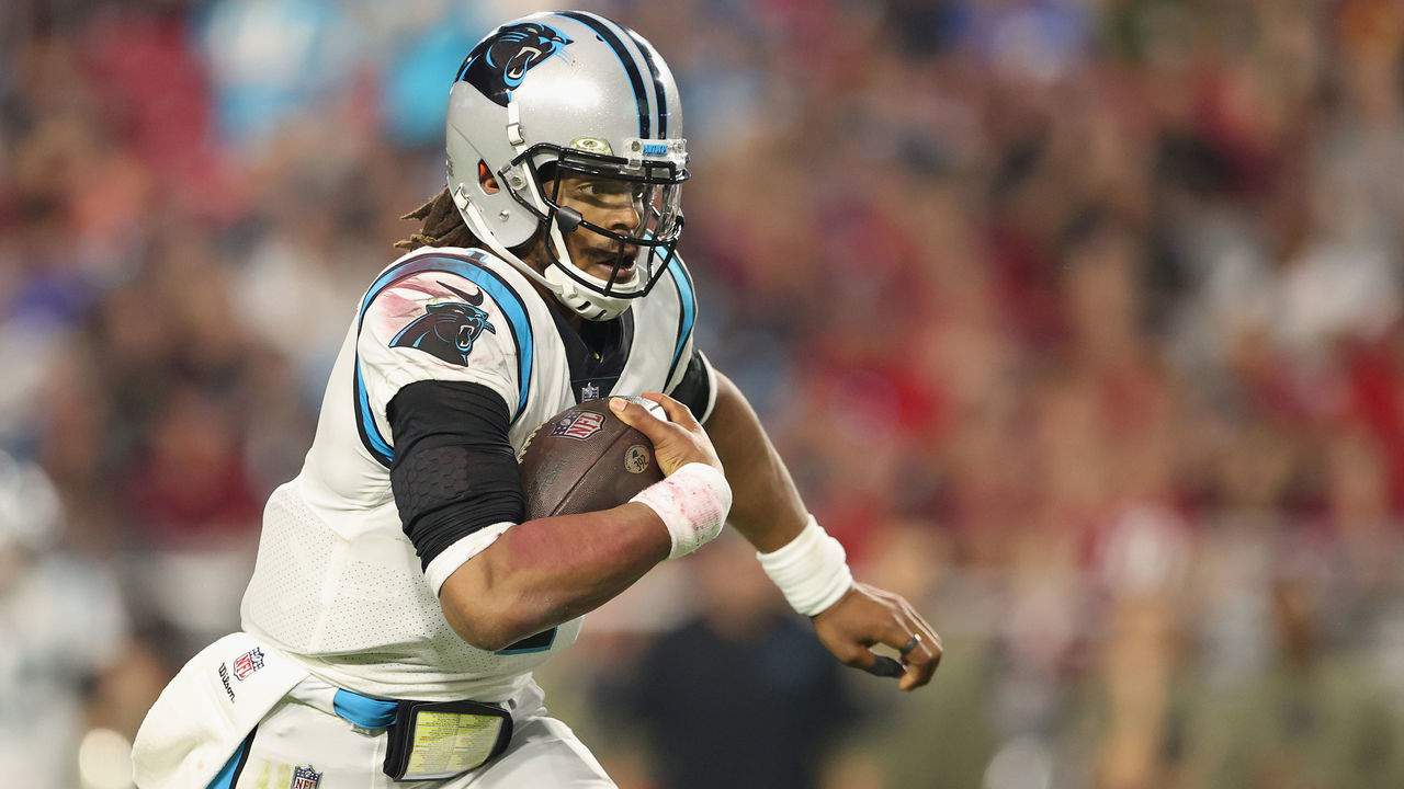 GLENDALE, ARIZONA - NOVEMBER 14: Quarterback Cam Newton #1 of the Carolina Panthers scrambles with the football against the Arizona Cardinals during the fourth quarter of the NFL game at State Farm Stadium on November 14, 2021 in Glendale, Arizona. The Panthers defeated the Cardinals 34-10.