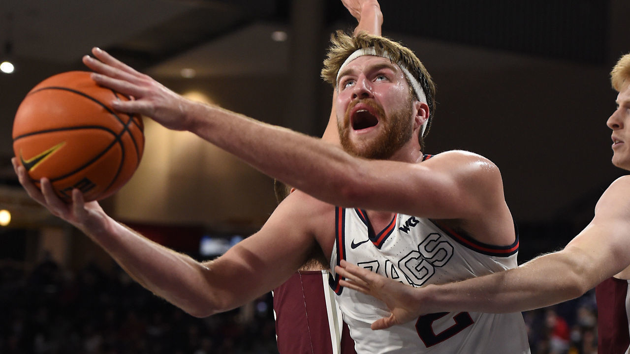 SPOKANE, WA - NOVEMBER 19: Drew Timme #2 of the Gonzaga Bulldogs splits two defenders to put up a shot during the game between the Bellarmine Knights and the Gonzaga Bulldogs at McCarthey Athletic Center on November 19, 2021 in Spokane, Washington.