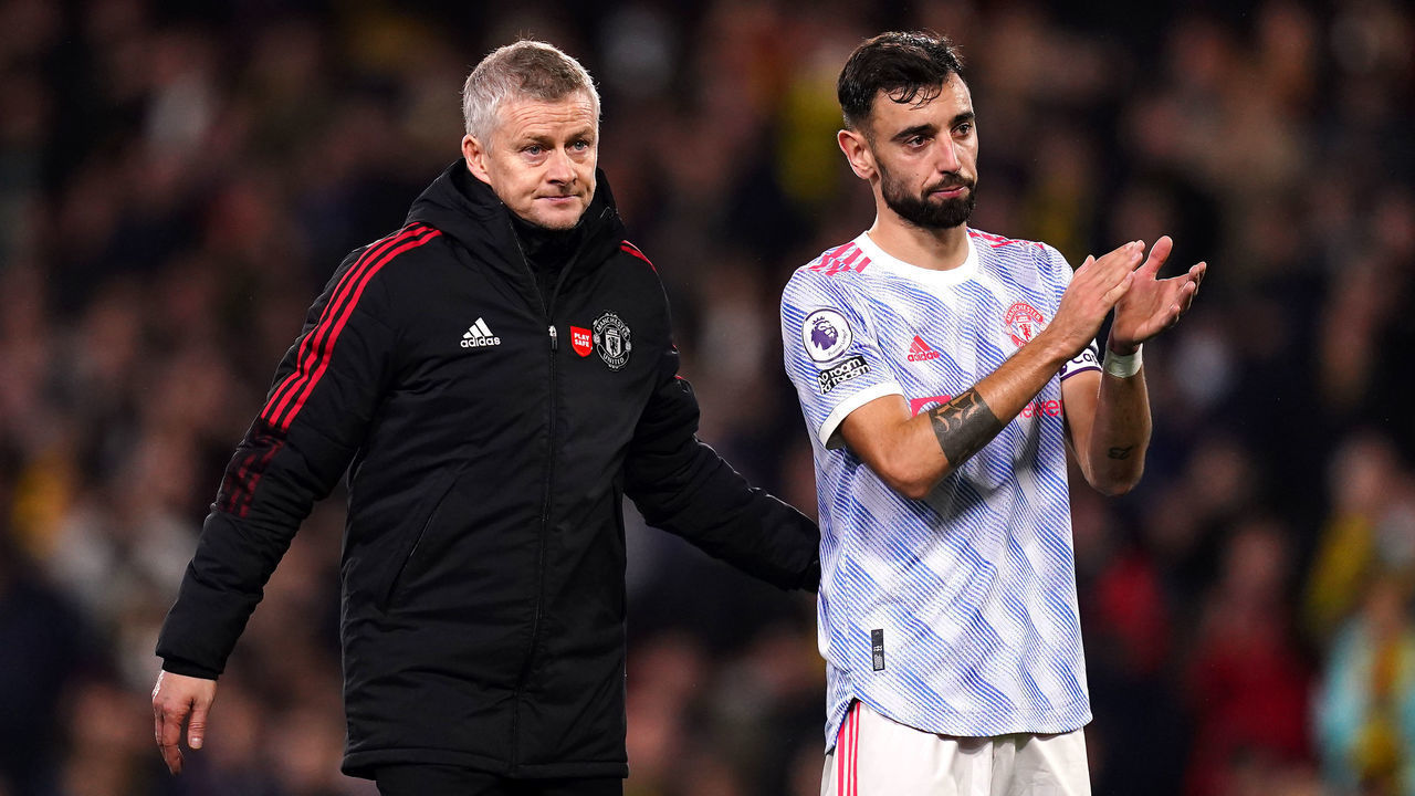 Manchester United manager Ole Gunnar Solskjaer (left) and Bruno Fernandes applaud the fans after the final whistle during the Premier League match at Vicarage Road, Watford. Picture date: Saturday November 20, 2021.