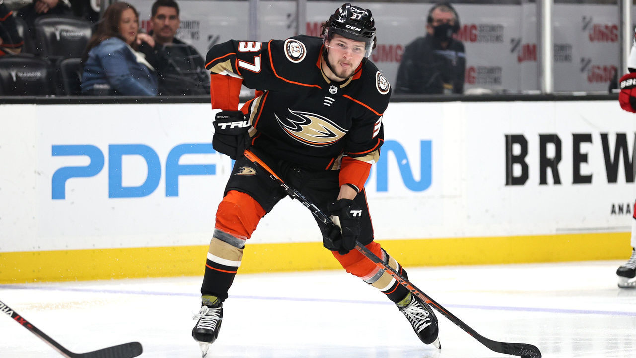 ANAHEIM, CALIFORNIA - NOVEMBER 18: Mason McTavish #37 of the Anaheim Ducks shoots the puck during the third period of a game against the Carolina Hurricanes at Honda Center on November 18, 2021 in Anaheim, California.