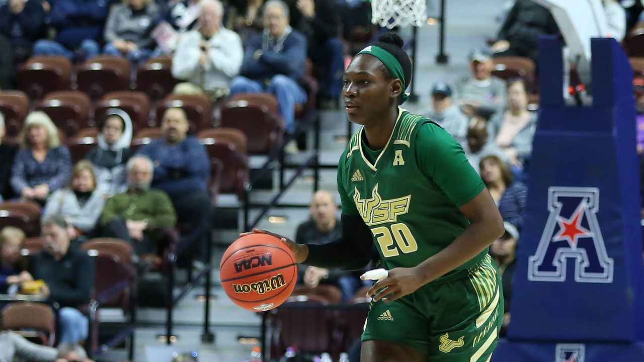 UNCASVILLE, CT - MARCH 08: USF Bulls forward Bethy Mununga (20) dribbles the ball up court during the women's American Athletic Conference Tournament game between USF Bulls and UConn Huskies on March 8, 2020, at Mohegan Sun Arena in Uncasville, CT.