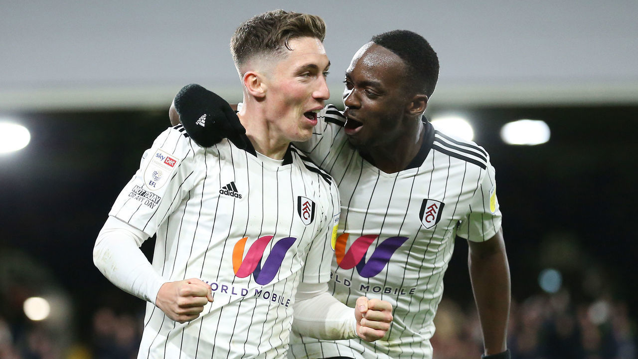LONDON, ENGLAND - NOVEMBER 20: Harry Wilson of Fulham celebrates after scoring their team's fourth goal with Neeskens Kebano of Fulham during the Sky Bet Championship match between Fulham and Barnsley at Craven Cottage on November 20, 2021 in London, England.