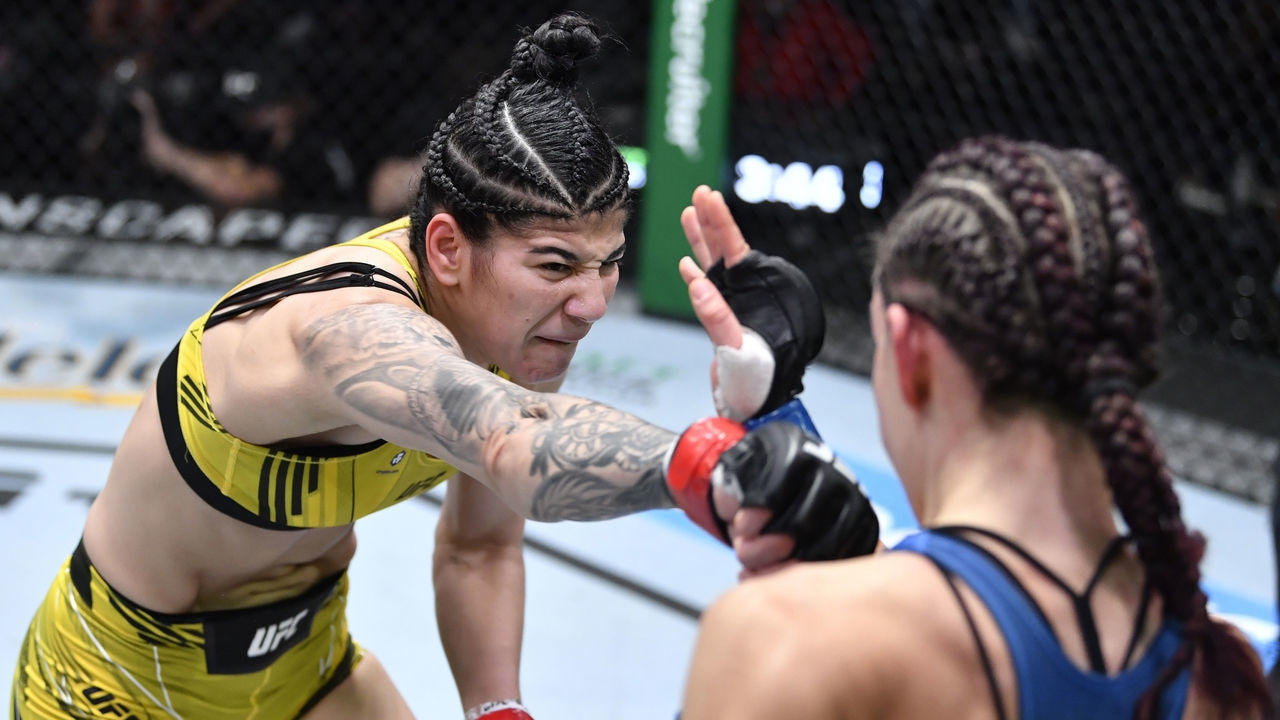 LAS VEGAS, NEVADA - NOVEMBER 20: (L-R) Ketlen Vieira of Brazil punches Miesha Tate in a bantamweight fight during the UFC Fight Night event at UFC APEX on November 20, 2021 in Las Vegas, Nevada.