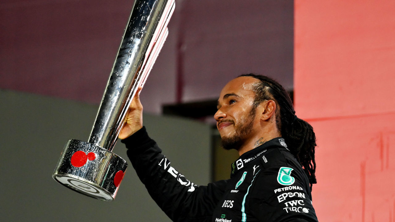 DOHA, QATAR - NOVEMBER 21: Race winner Lewis Hamilton of Great Britain and Mercedes GP celebrates on the podium during the F1 Grand Prix of Qatar at Losail International Circuit on November 21, 2021 in Doha, Qatar.