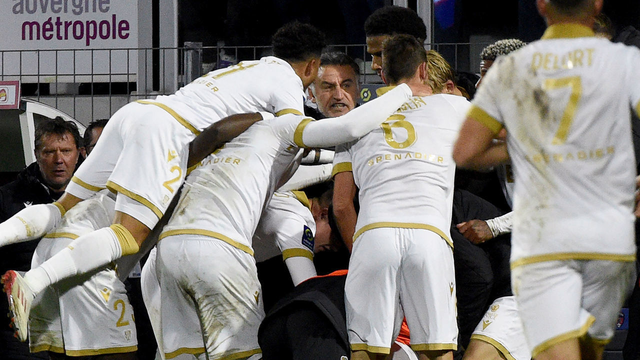Nice's French forward Amine Gouiri celebrates with teammates after scoring his team's first goal during the French L1 football match between Clermont (CF63) and Nice (OGCN) in Clermont-Ferrand on November 21, 2021 at the Gabriel-Montpied stadium.