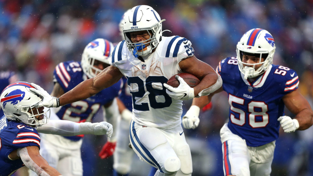 ORCHARD PARK, NEW YORK - NOVEMBER 21: Jonathan Taylor #28 of the Indianapolis Colts runs the ball for a touchdown in the game against the Buffalo Bills during the third quarter at Highmark Stadium on November 21, 2021 in Orchard Park, New York.