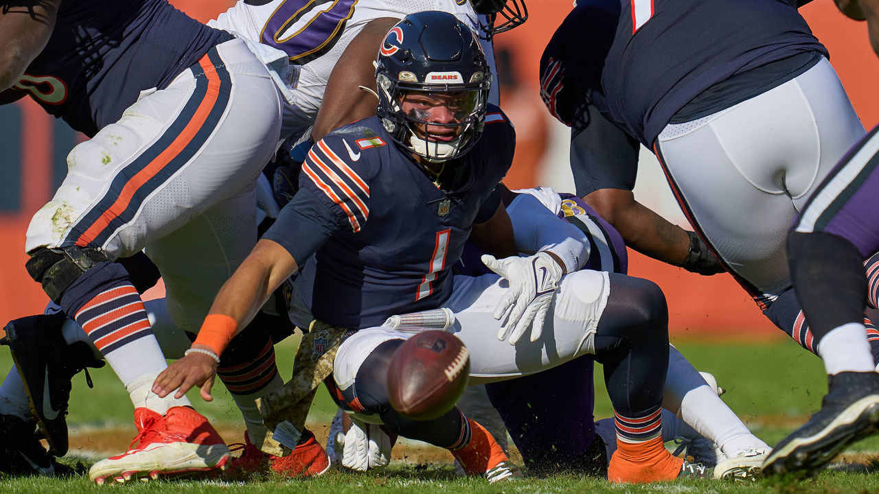 CHICAGO, IL - NOVEMBER 21: Chicago Bears quarterback Justin Fields (1) fumbles the football during a game between the Chicago Bears and the Baltimore Ravens on November 21, 2021 at Soldier Field, in Chicago, IL.