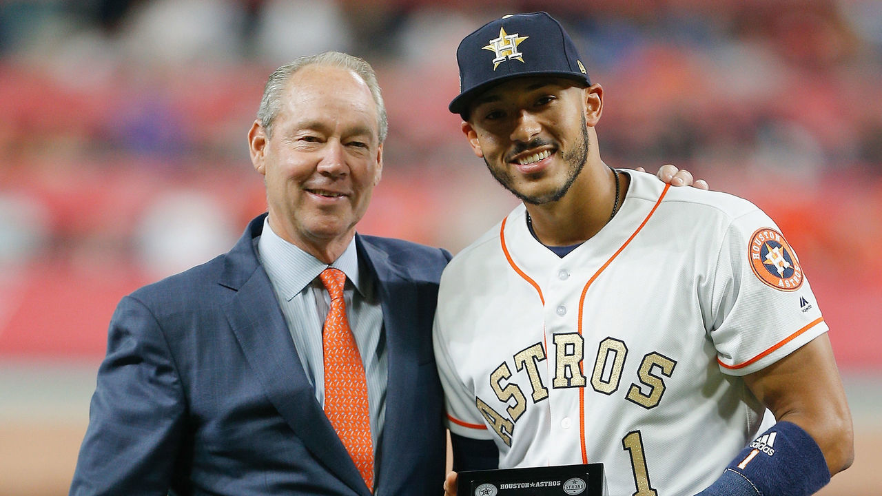 HOUSTON, TX - APRIL 03: Houston Astros owner Jim Crane presents a World Series ring to Carlos Correa #1 of the Houston Astros at Minute Maid Park on April 3, 2018 in Houston, Texas.