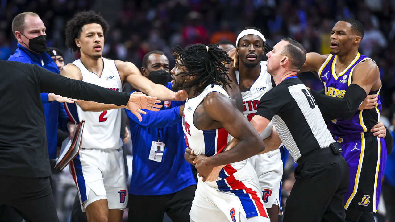 DETROIT, MICHIGAN - NOVEMBER 21: Isaiah Stewart #28 of the Detroit Pistons is restrained as he goes after LeBron James #6 of the Los Angeles Lakers during the third quarter of the game at Little Caesars Arena on November 21, 2021 in Detroit, Michigan.