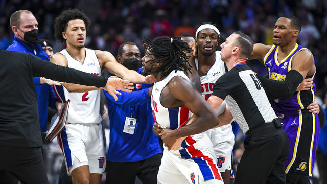 DETROIT, MICHIGAN - NOVEMBER 21: Isaiah Stewart #28 of the Detroit Pistons is restrained as he goes after LeBron James #6 of the Los Angeles Lakers during the third quarter of the game at Little Caesars Arena on November 21, 2021 in Detroit, Michigan.