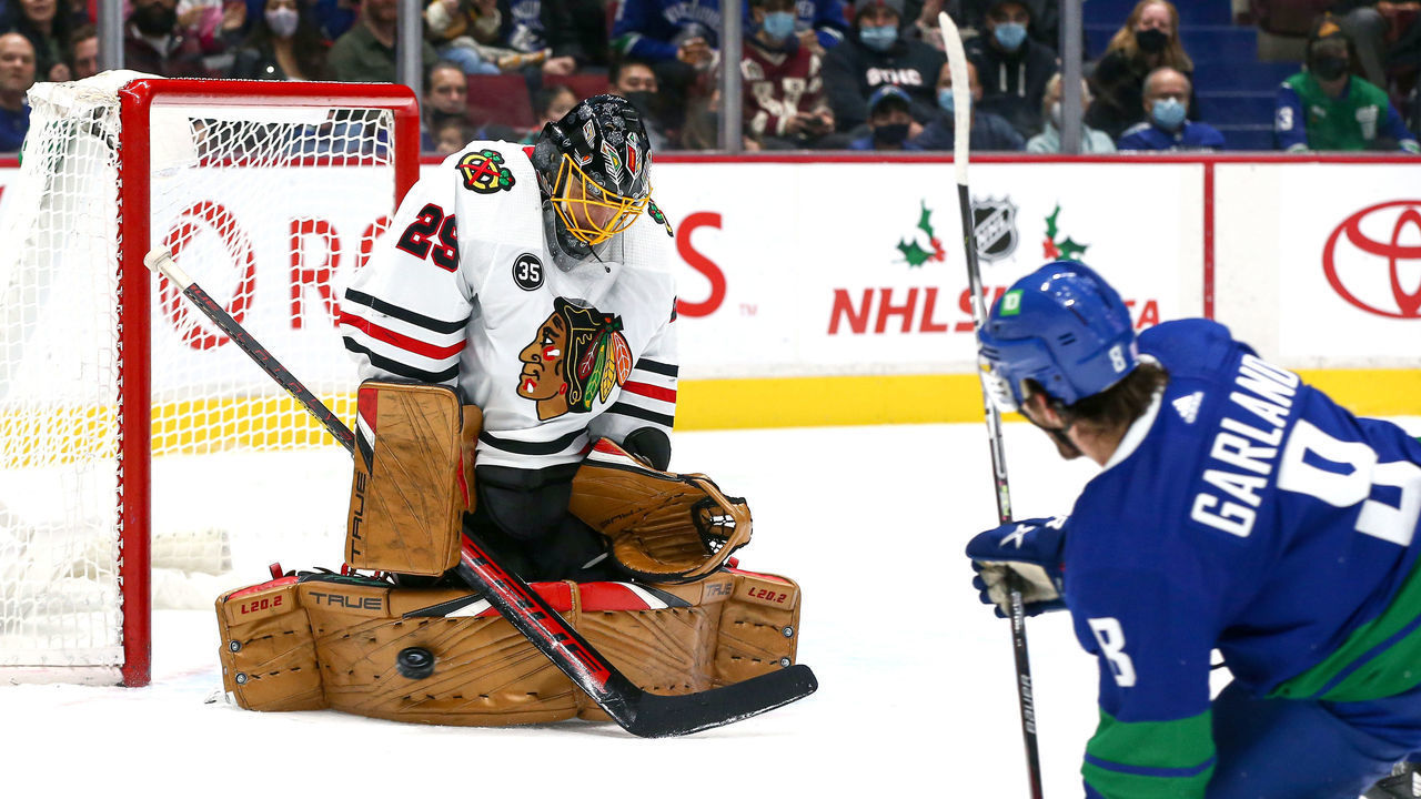 VANCOUVER, BC - NOVEMBER 21: Chicago Blackhawks Goalie Marc-Andre Fleury (29) makes a save against Vancouver Canucks Right Wing Conor Garland (8) during their NHL game at Rogers Arena on November 21, 2021 in Vancouver, British Columbia, Canada.
