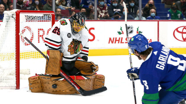 VANCOUVER, BC - NOVEMBER 21: Chicago Blackhawks Goalie Marc-Andre Fleury (29) makes a save against Vancouver Canucks Right Wing Conor Garland (8) during their NHL game at Rogers Arena on November 21, 2021 in Vancouver, British Columbia, Canada.