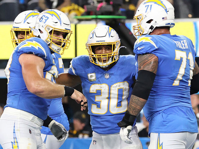 INGLEWOOD, CALIFORNIA - NOVEMBER 21: Austin Ekeler #30 of the Los Angeles Chargers celebrates with teammates after scoring a touchdown against the Pittsburgh Steelers at SoFi Stadium on November 21, 2021 in Inglewood, California.