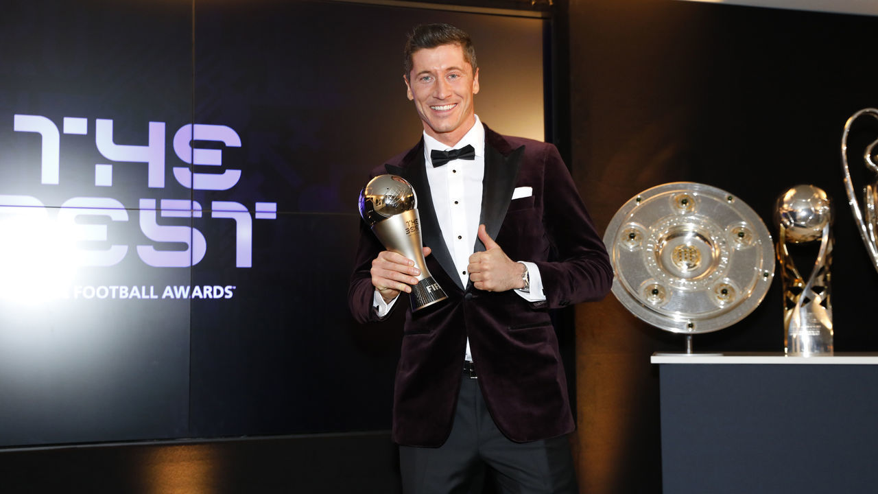 MUNICH, GERMANY - DECEMBER 17: Robert Lewandowski of FC Bayern Muenchen poses after winning the FIFA Men's Player 2020 trophy during the FIFA The BEST Awards ceremony on December 17, 2020 in Munich, Germany.