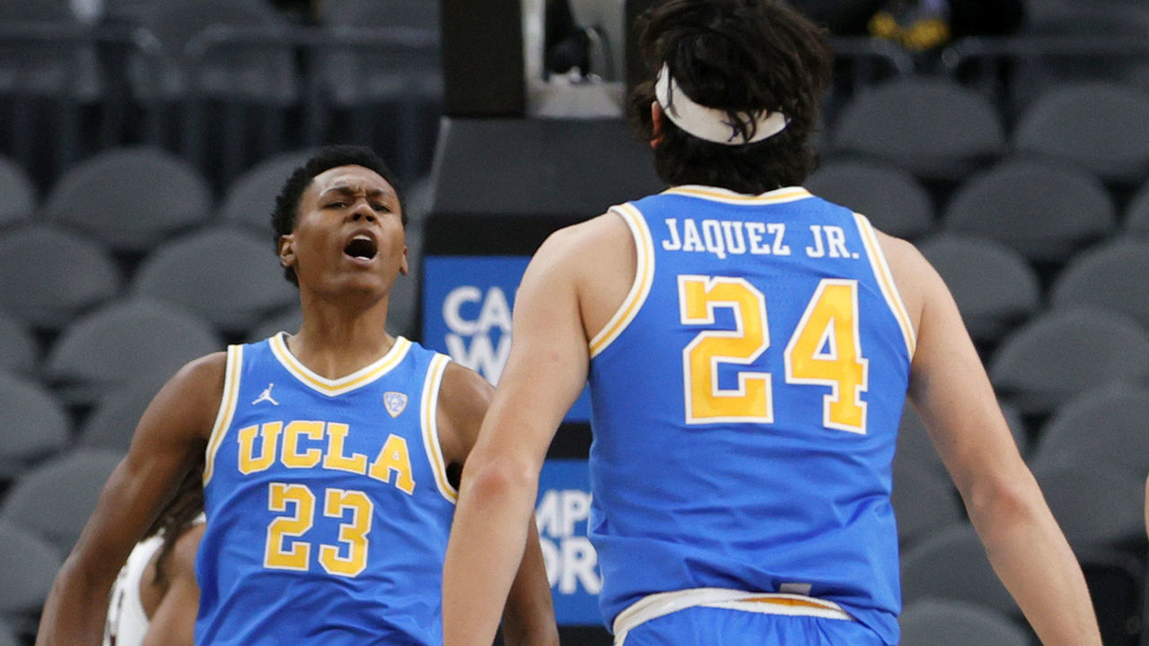 LAS VEGAS, NEVADA - NOVEMBER 22: Peyton Watson #23 and Jaime Jaquez Jr. #24 of the UCLA Bruins react after Jaquez stole the ball against the Bellarmine Knights and passed it to Watson who dunked during the Good Sam Empire Classic basketball tournament at T-Mobile Arena on November 22, 2021 in Las Vegas, Nevada.