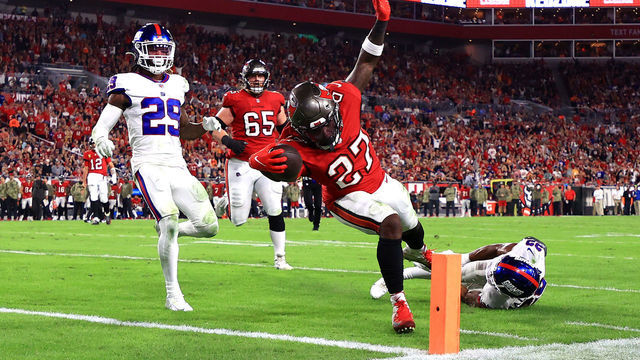 TAMPA, FLORIDA - NOVEMBER 22: Ronald Jones #27 of the Tampa Bay Buccaneers dives into the endzone for a touchdown in the second quarter of the game against the New York Giants at Raymond James Stadium on November 22, 2021 in Tampa, Florida.