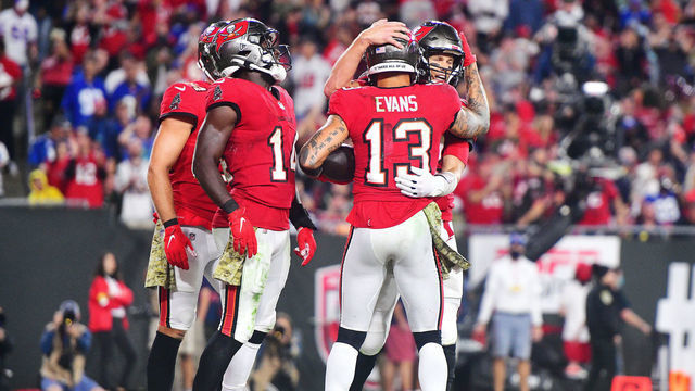 TAMPA, FLORIDA - NOVEMBER 22: Tom Brady #12 of the Tampa Bay Buccaneers congratulates Mike Evans #13 of the Tampa Bay Buccaneers, after catching a touchdown pass to become the player with the most touchdowns in Buccaneers history, against the New York Giants during the third quarter at Raymond James Stadium on November 22, 2021 in Tampa, Florida.