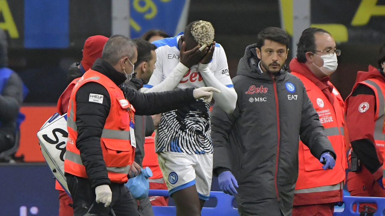 SAN SIRO STADIUM, MILANO, ITALY - 2021/11/21: Victor Osimhen of SSC Napoli leaves the pitch after a serious injury, cheekbone and orbit fractures, during the Serie A football match between FC Internazionale and SSC Napoli. FC Internazionale won 3-2 over SSC Napoli.