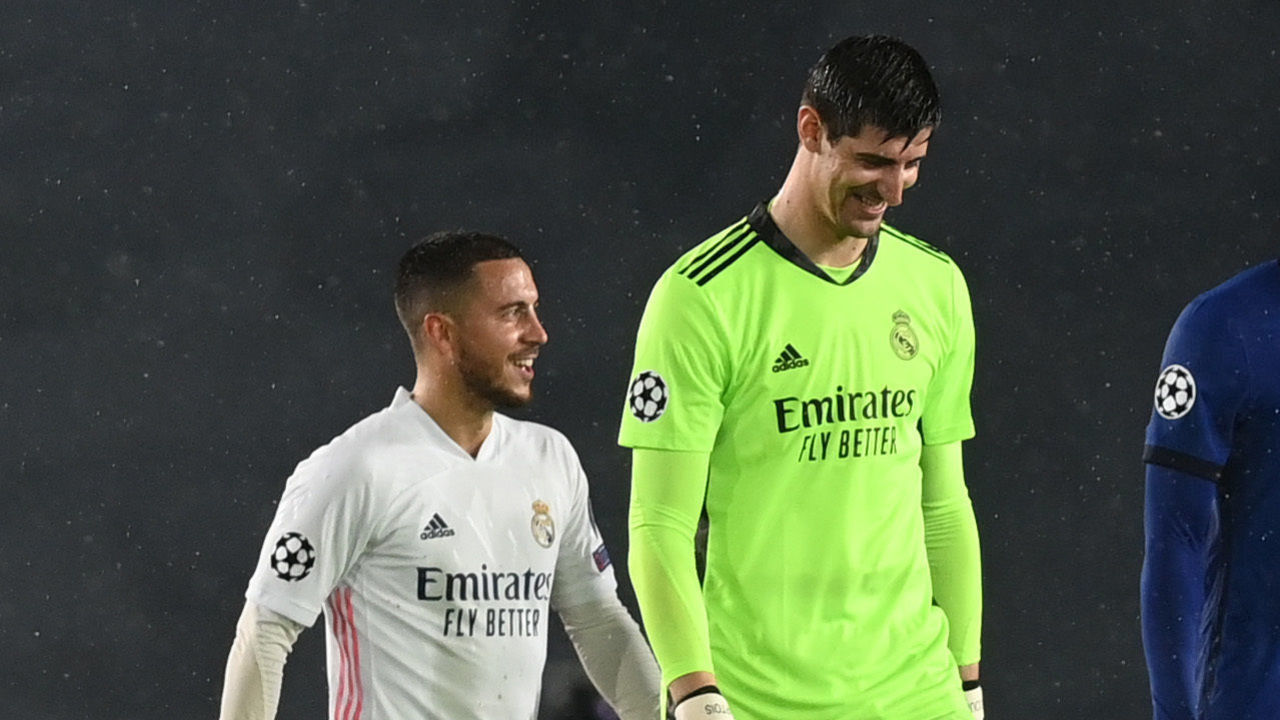 MADRID, SPAIN - APRIL 27: Eden Hazard of Real Madrid interacts with team mate Thibaut Courtois and Antonio Ruediger of Chelsea after the UEFA Champions League Semi Final First Leg match between Real Madrid and Chelsea FC at Estadio Alfredo Di Stefano on April 27, 2021 in Madrid, Spain. Sporting stadiums around Spain remain under strict restrictions due to the Coronavirus Pandemic as Government social distancing laws prohibit fans inside venues resulting in games being played behind closed doors.
