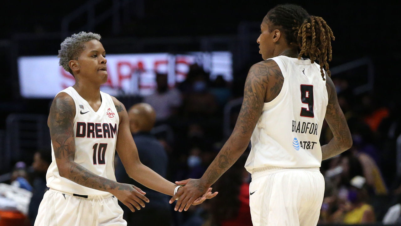 LOS ANGELES, CALIFORNIA - AUGUST 17: Odyssey Sims #0, Candice Dupree #24, Courtney Williams #10, and Crystal Bradford #9 of the Atlanta Dream high-five on the court during a game against the Los Angeles Sparks at Staples Center on August 17, 2021 in Los Angeles, California.
