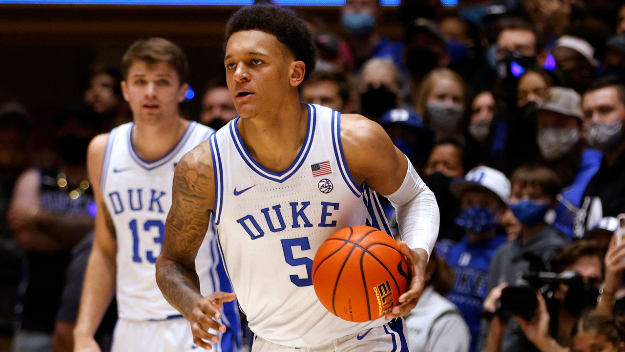DURHAM, NC - NOVEMBER 16: Paolo Banchero #5 of the Duke Blue Devils moves the ball against Anthony Selden #23 of the Gardner-Webb Runnin' Bulldogs in the second half at Cameron Indoor Stadium on November 16, 2021 in Durham, North Carolina.