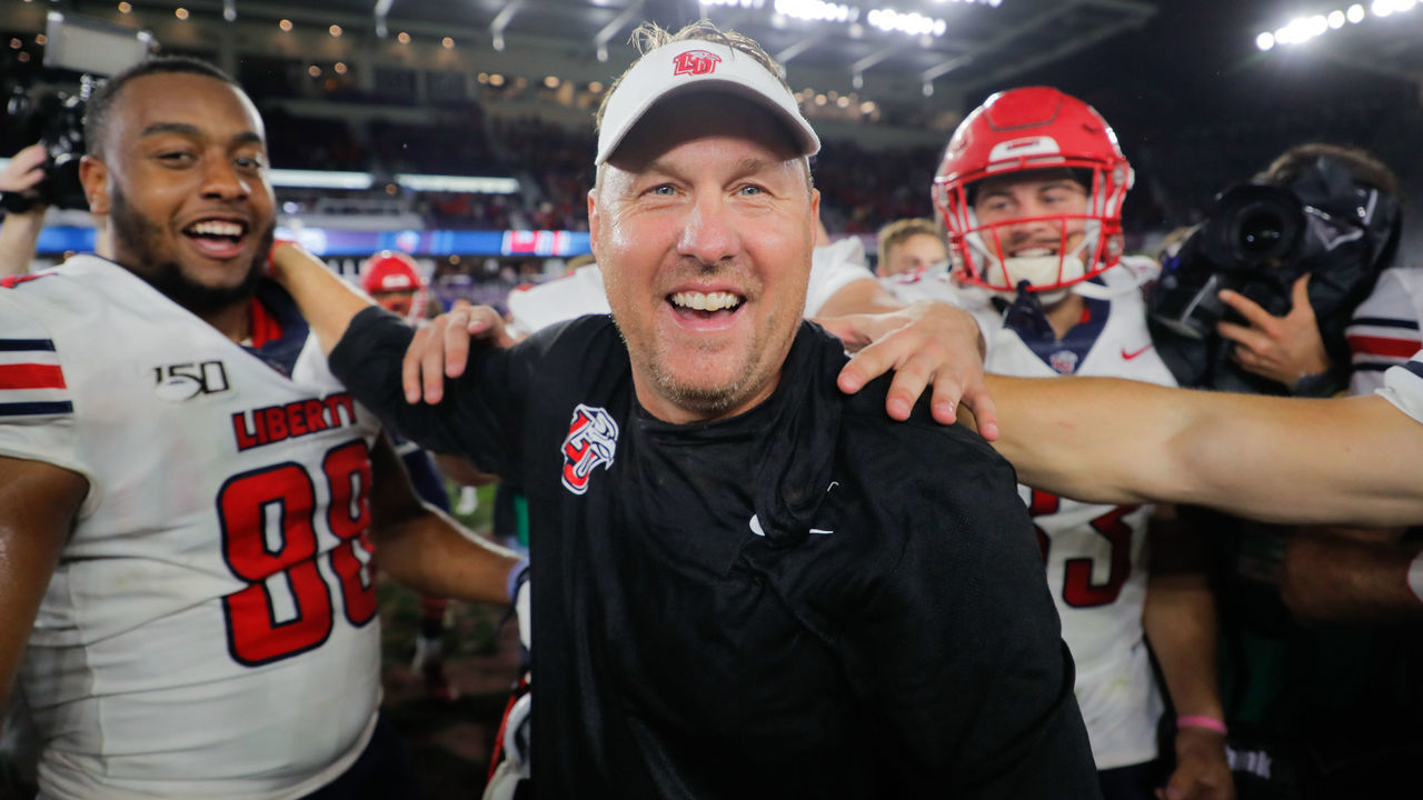 ORLANDO, FLORIDA - DECEMBER 21: Head coach Hugh Freeze of the Liberty Flames celebrates with his team after defeating the Georgia Southern Eagles in the 2019 Cure Bowl at Exploria Stadium on December 21, 2019 in Orlando, Florida.