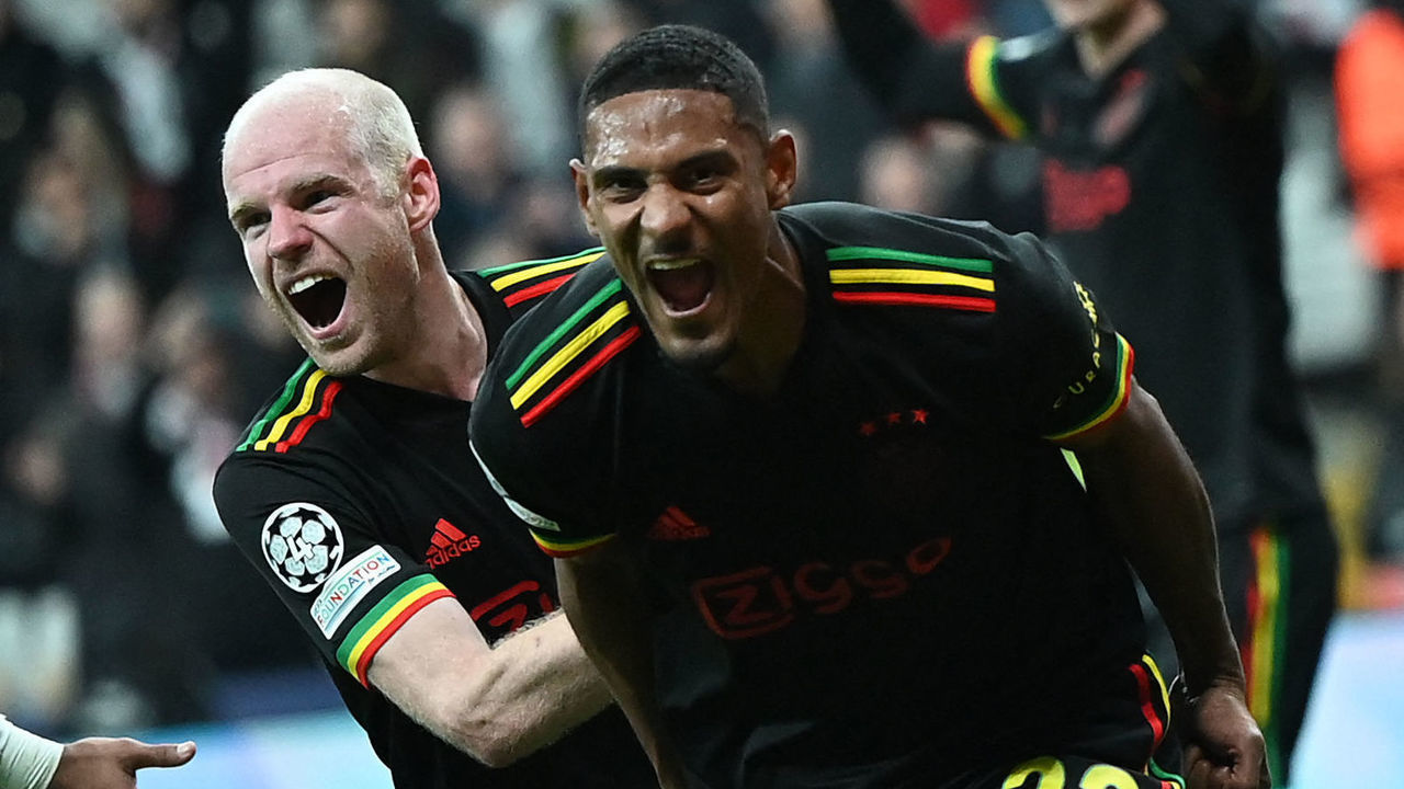Ajax's Ivorian forward Sebastien Haller (R) celebrates with Ajax's Dutch midfielder Davy Klaassen after scoring his team's second goal during the UEFA Champions League group C football match between Besiktas JK and AFC Ajax at Vodafone Park stadium in Istanbul on November 24, 2021.