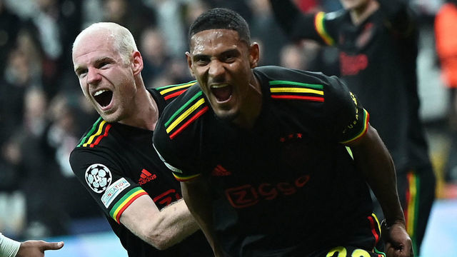 Ajax's Ivorian forward Sebastien Haller (R) celebrates with Ajax's Dutch midfielder Davy Klaassen after scoring his team's second goal during the UEFA Champions League group C football match between Besiktas JK and AFC Ajax at Vodafone Park stadium in Istanbul on November 24, 2021.