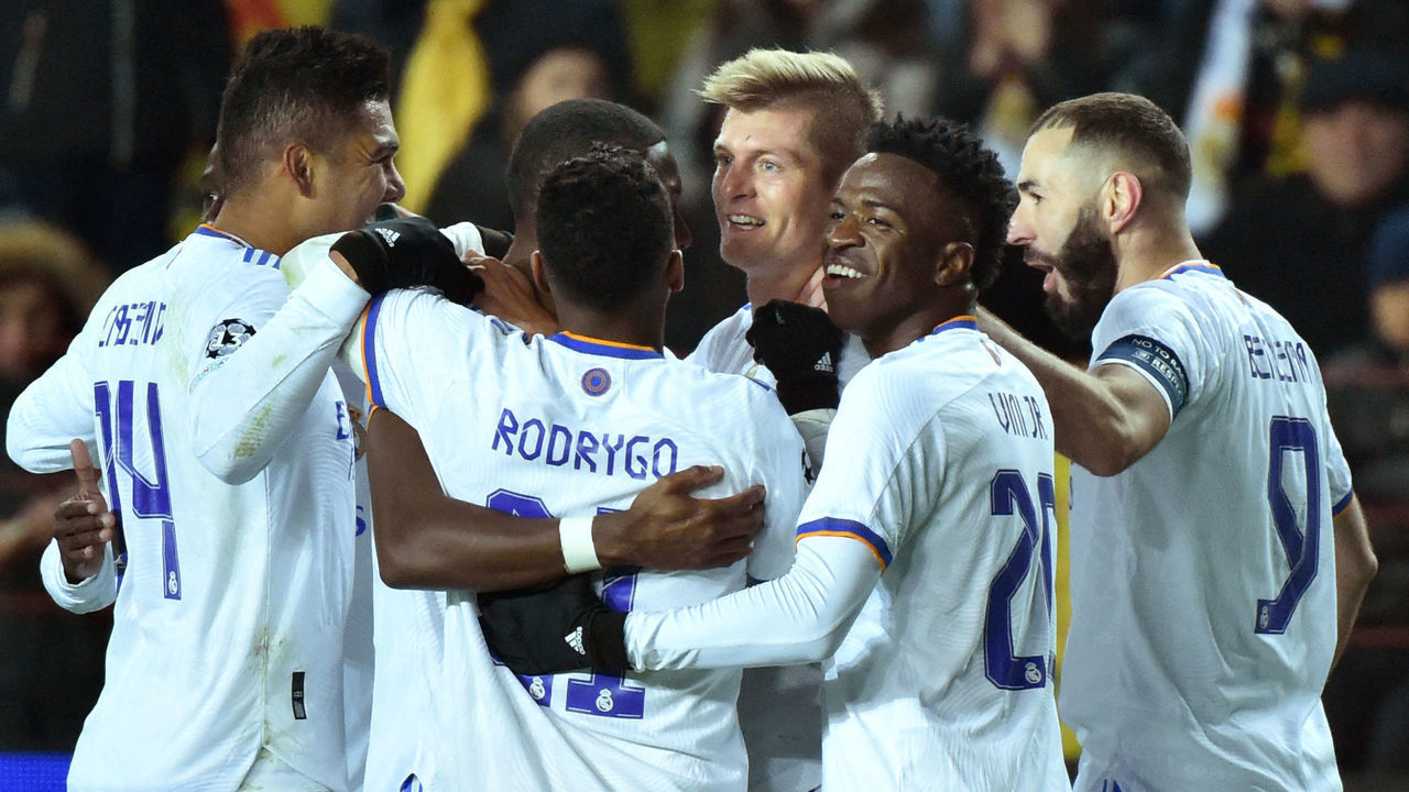 Real Madrid's German midfielder Toni Kroos celebrates with teammates after scoring their second goal during the UEFA Champions League football match between Sheriff and Real Madrid at Sheriff Stadium in Tiraspol on November 24, 2021.
