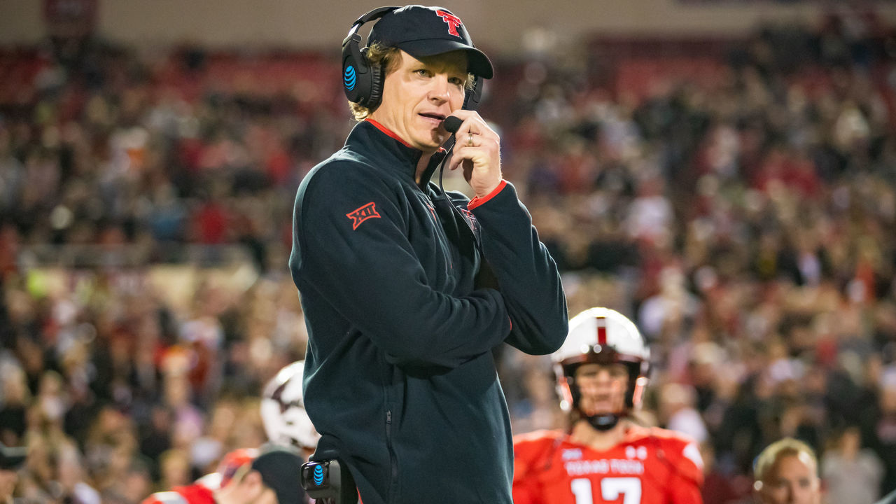 LUBBOCK, TEXAS - NOVEMBER 20: Interim head coach Sonny Cumbie of the Texas Tech Red Raiders stands on the sideline before the college football game against the Oklahoma State Cowboys at Jones AT&T Stadium on November 20, 2021 in Lubbock, Texas.
