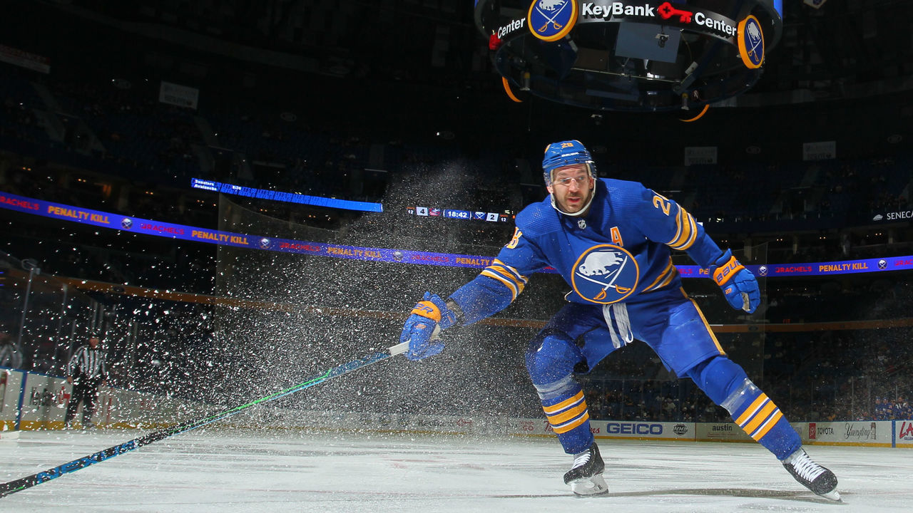 BUFFALO, NY - NOVEMBER 22: Zemgus Girgensons #28 of the Buffalo Sabres defends against the Columbus Blue Jackets during an NHL game on November 22, 2021 at KeyBank Center in Buffalo, New York.