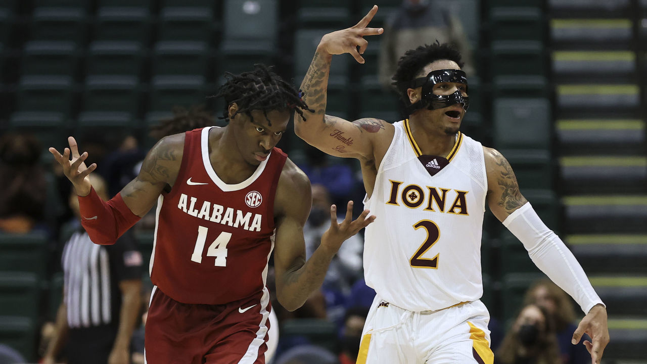 ORLANDO, FL - NOVEMBER 25: Iona Gaels guard Elijah Joiner (2) celebrates as Alabama Crimson Tide guard Keon Ellis (14) reacts to Iona taking the lead in the 2nd half of the ESPN Events Invitational college basketball game between the Alabama Crimson Tide and Iona Gaels on November 25, 2021 at the HP Field House in Orlando, FL.