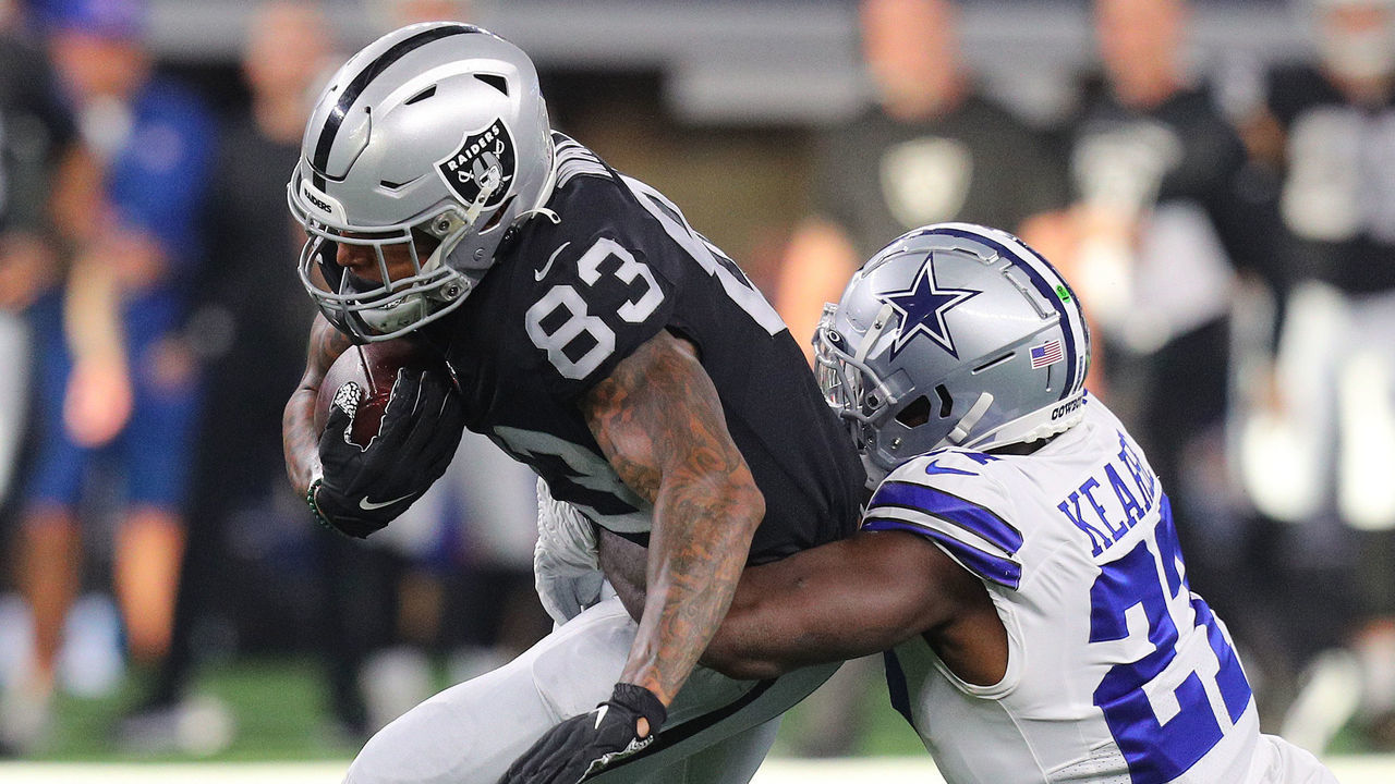 ARLINGTON, TEXAS - NOVEMBER 25: Darren Waller #83 of the Las Vegas Raiders is tackled by Jayron Kearse #27 of the Dallas Cowboys during the second quarter of the NFL match between Las Vegas Raiders and Dallas Cowboys at AT&T Stadium on November 25, 2021 in Arlington, Texas.