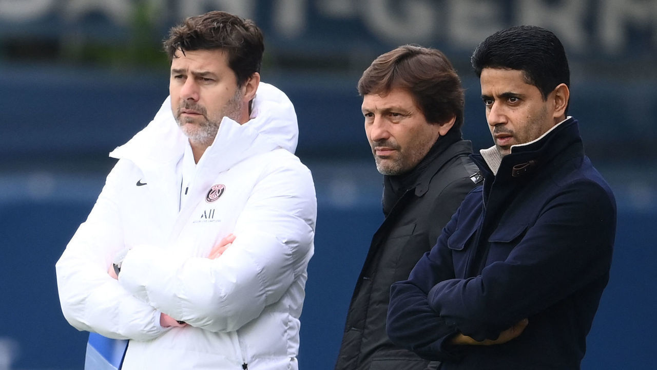 Paris Saint-Germain's Qatari president Nasser Al-Khelaifi (R) looks on next to Paris Saint-Germain's Argentinian head coach Mauricio Pochettino (L) and Brazilian sporting director Leonardo during a training session at the club's Camp des Loges training ground in Saint-Germain-en-Laye, on the eve of their UEFA Champions Leage first round group A football match against RB Leipzig , on October 18, 2021.