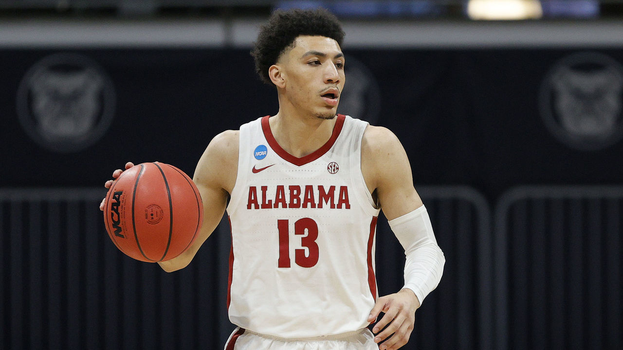 INDIANAPOLIS, INDIANA - MARCH 28: Jahvon Quinerly #13 of the Alabama Crimson Tide drives down court against the UCLA Bruins during the first half in the Sweet Sixteen round game of the 2021 NCAA Men's Basketball Tournament at Hinkle Fieldhouse on March 28, 2021 in Indianapolis, Indiana.