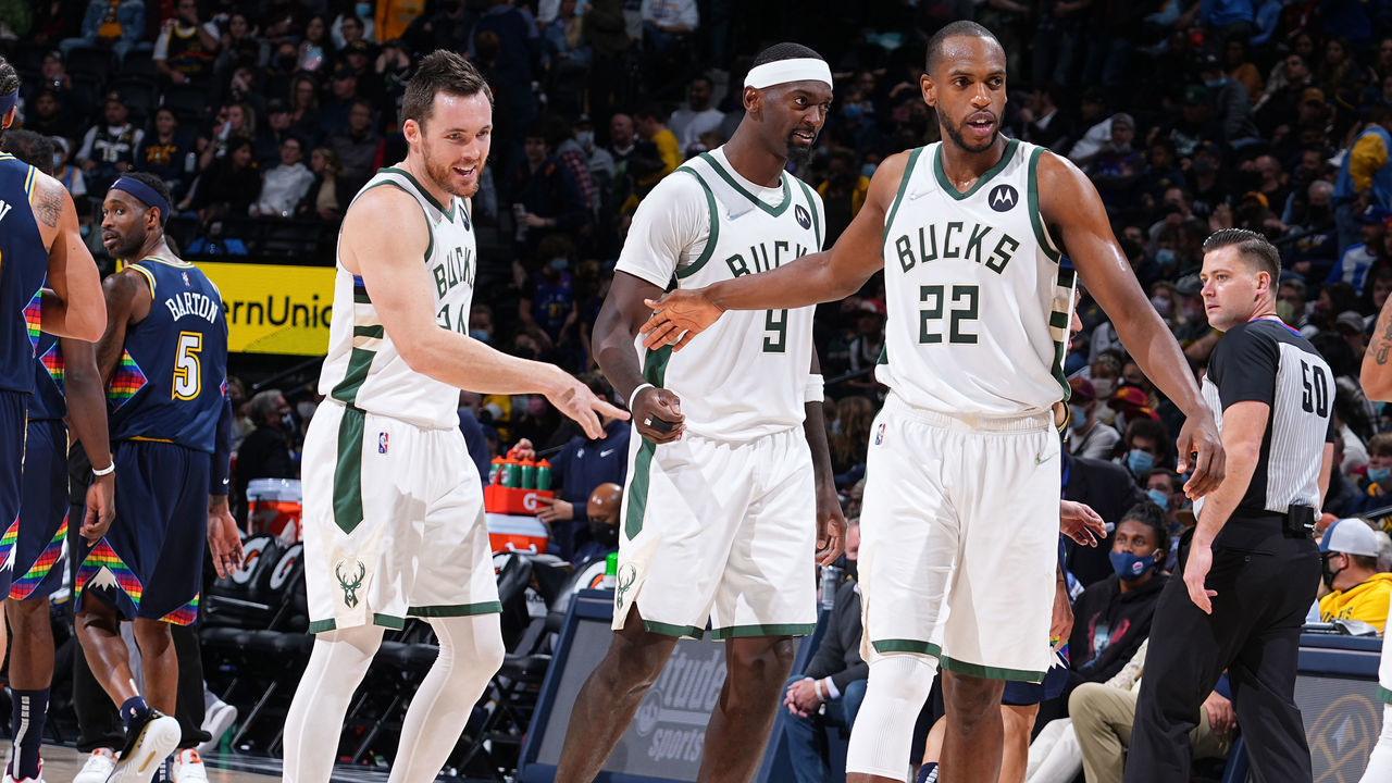 DENVER, CO - NOVEMBER 26: Pat Connaughton #24 of the Milwaukee Bucks, Bobby Portis #9 of the Milwaukee Bucks, and Khris Middleton #22 of the Milwaukee Bucks smile after a game against the Denver Nuggets on November 26, 2021 at the Ball Arena in Denver, Colorado. NOTE TO USER: User expressly acknowledges and agrees that, by downloading and/or using this Photograph, user is consenting to the terms and conditions of the Getty Images License Agreement. Mandatory Copyright Notice: Copyright 2021 NBAE
