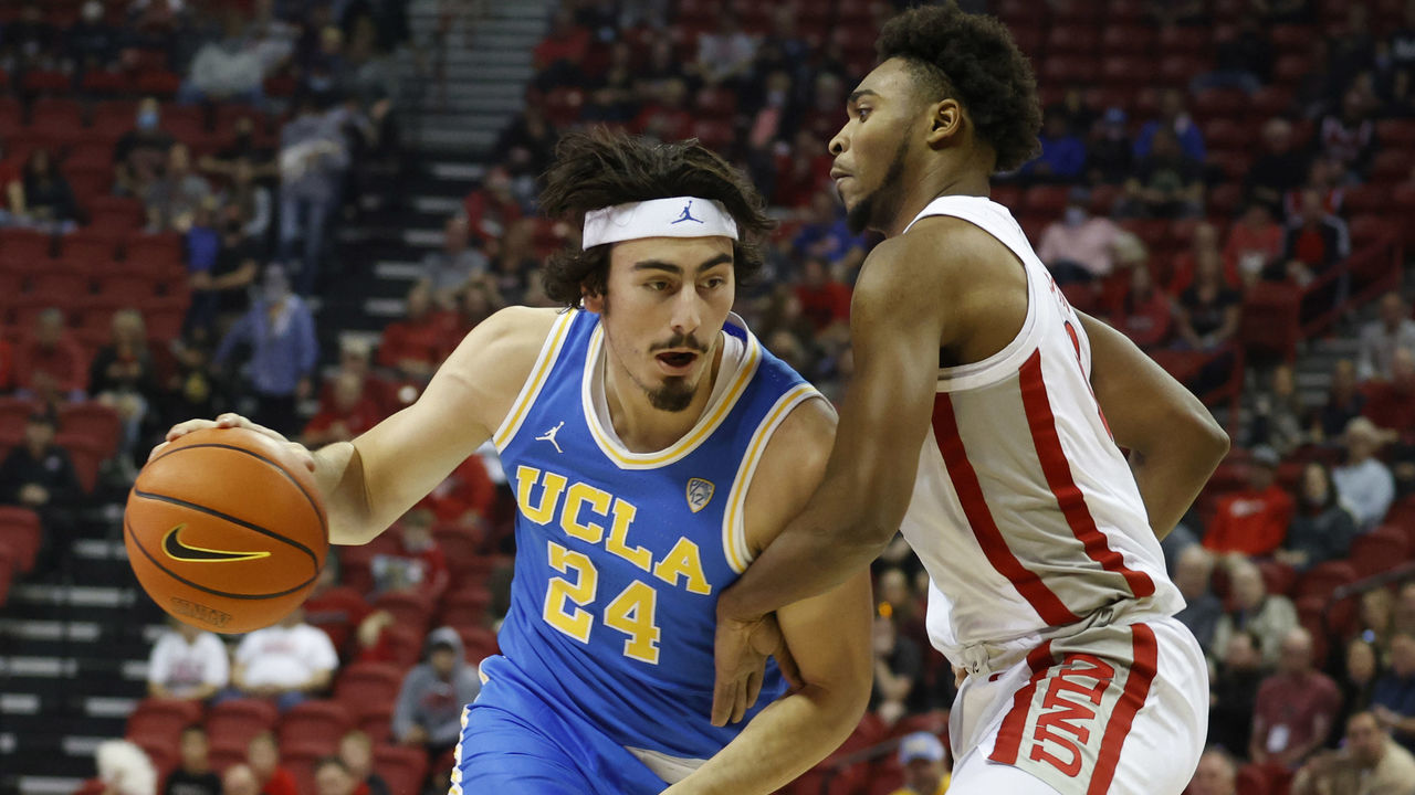LAS VEGAS, NV - NOVEMBER 27: UCLA Bruins guard Peyton Watson (23) drives to the basket against UNLV Runnin' Rebels guard Bryce Hamilton (13) on November 27, 2021 at the Thomas & Mack Center in Las Vegas, Nevada.