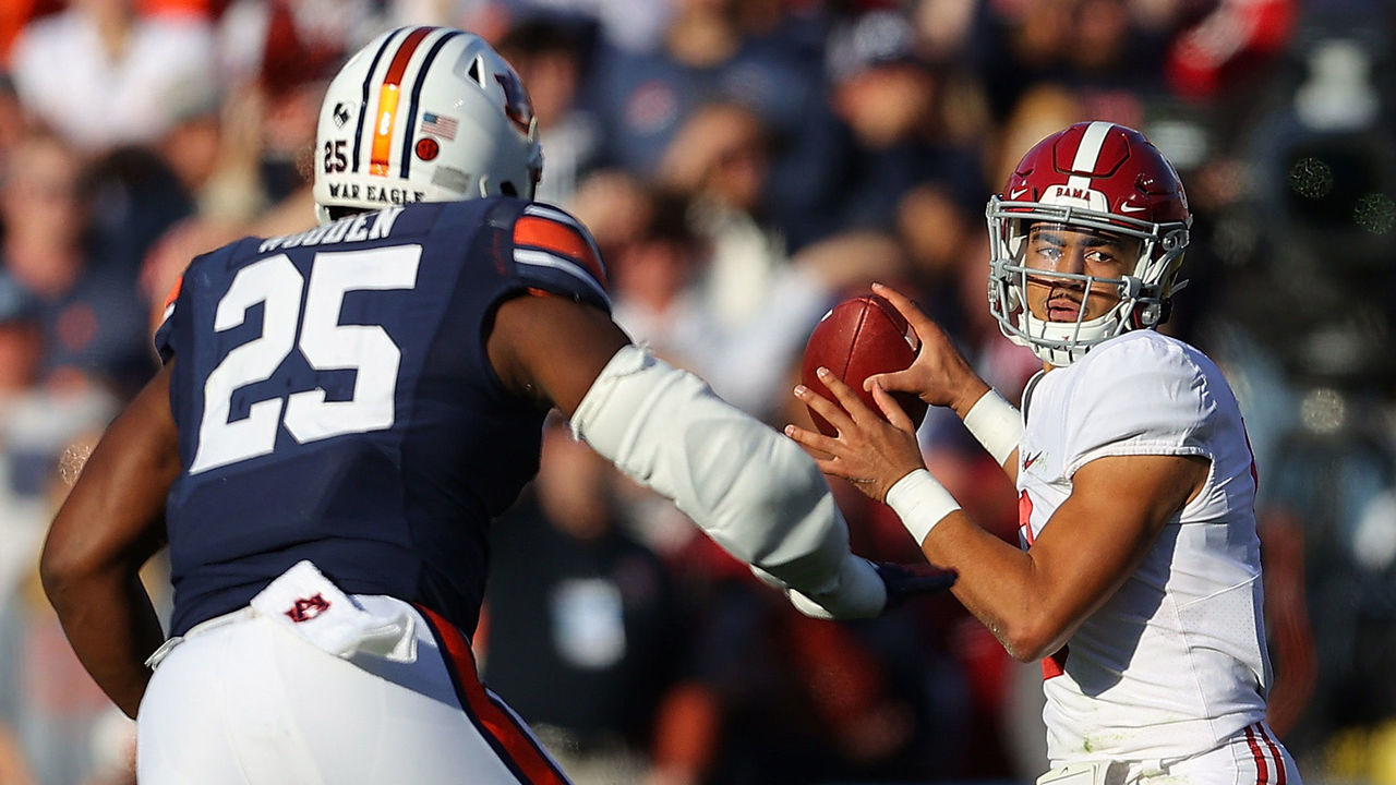 AUBURN, ALABAMA - NOVEMBER 27: Bryce Young #9 of the Alabama Crimson Tide looks to pass against the Auburn Tigers during the first half at Jordan-Hare Stadium on November 27, 2021 in Auburn, Alabama.